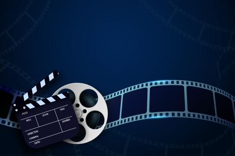 image depicting movie clapperboard and film reel