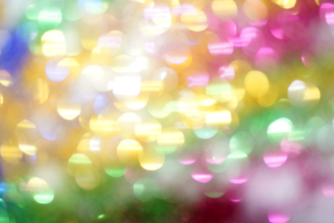 yellow, pink, green, and blue sequin bokeh effect