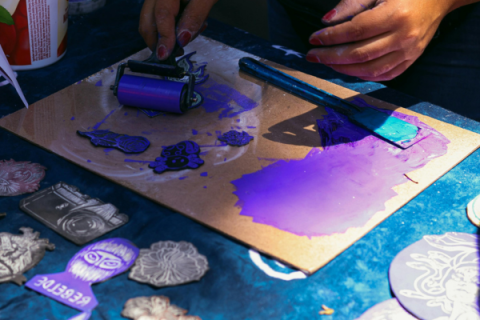 Hands Creating Vibrant Linocut Art Prints