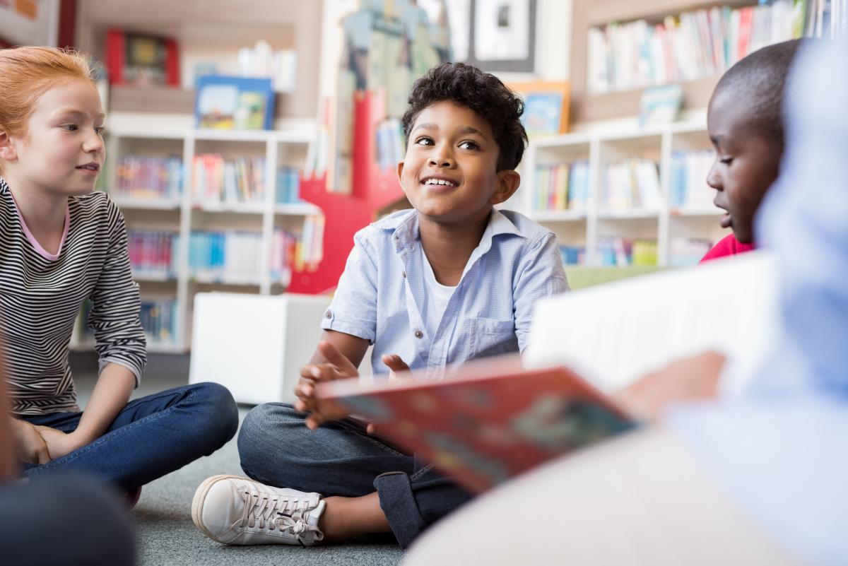 Children in reading circle in library