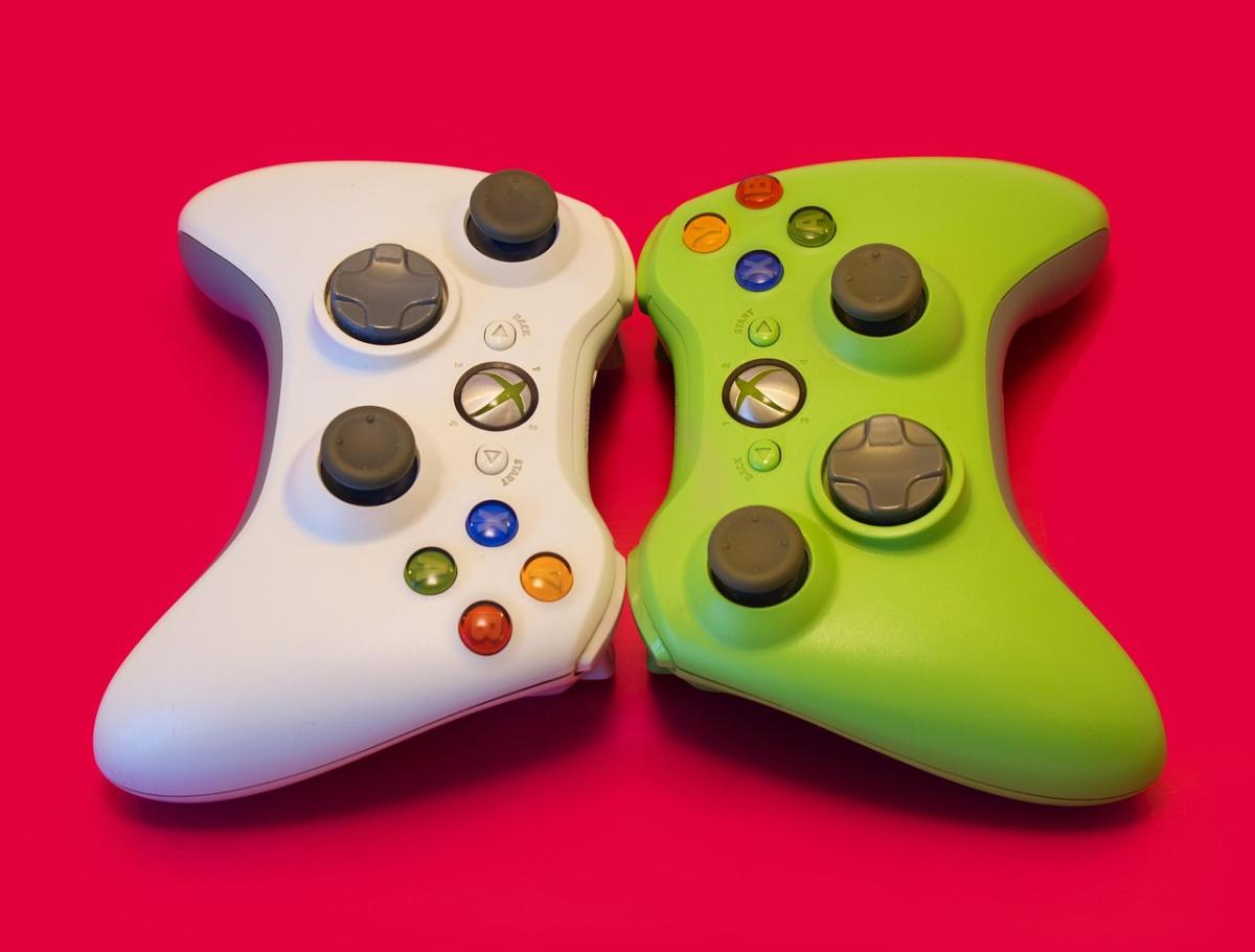 Xbox controllers against red background